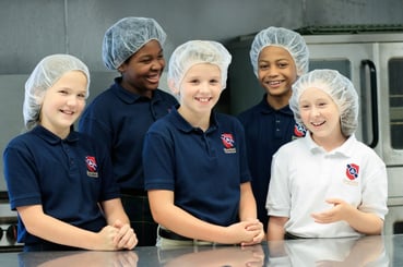 students pack meal for hungry children